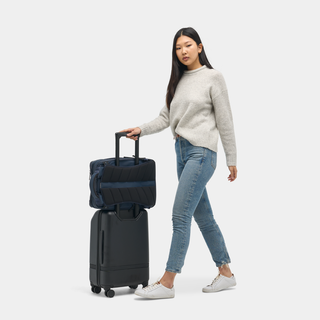 Nomatic Travel Pack 20L navy side angle showing sleek profile