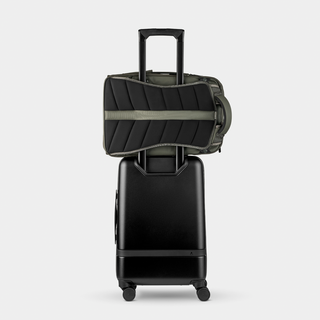 Nomatic Travel Pack 20L olive rear view showing luggage handle pass-through